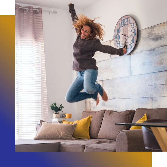 A woman energetically jumping in a living room with a clock, showcasing her impressive moves while people watch and provide reviews.